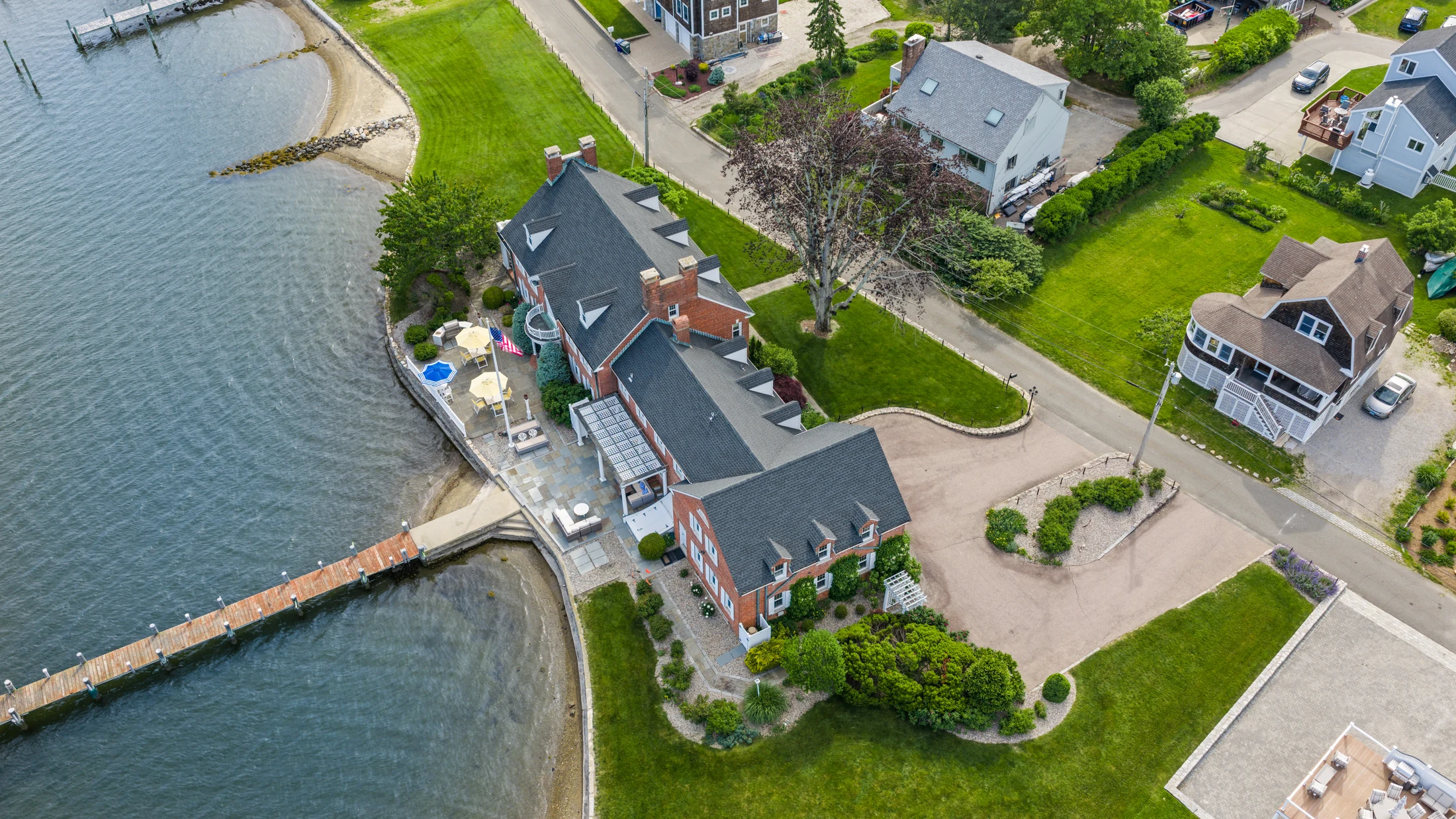 Aerial view looking straight down over the point, the lawn, and the shoreline.